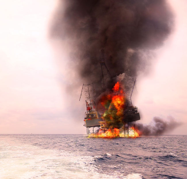 oil rig on fire in the water
