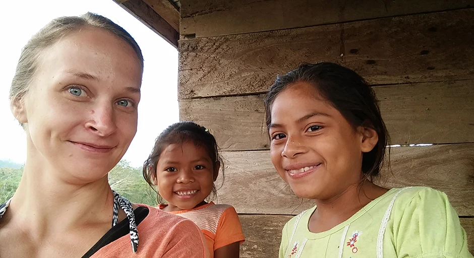 3 people looking at camera. One adult and two children