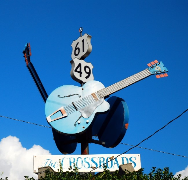 sign with a guitar at the crossroads of Clarksdale in the Mississippi Delta
