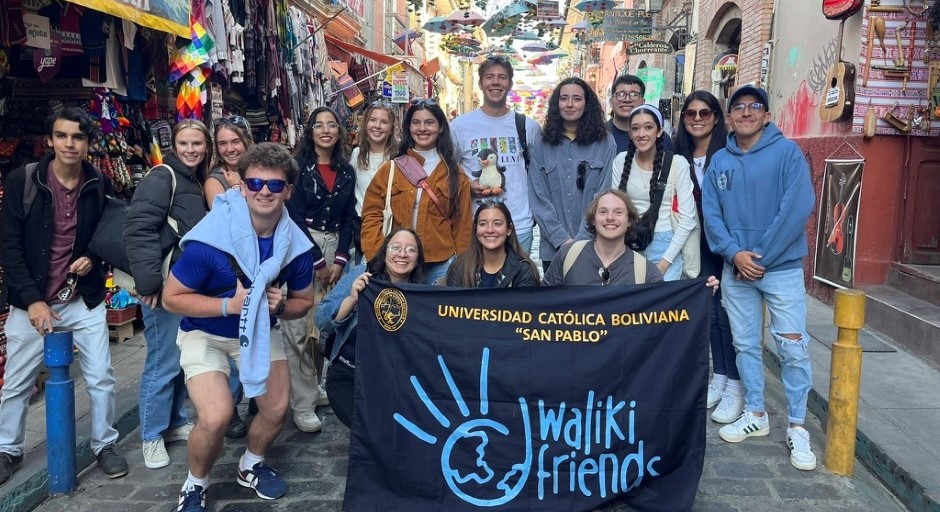 group of students holding a banner in the street of La Paz