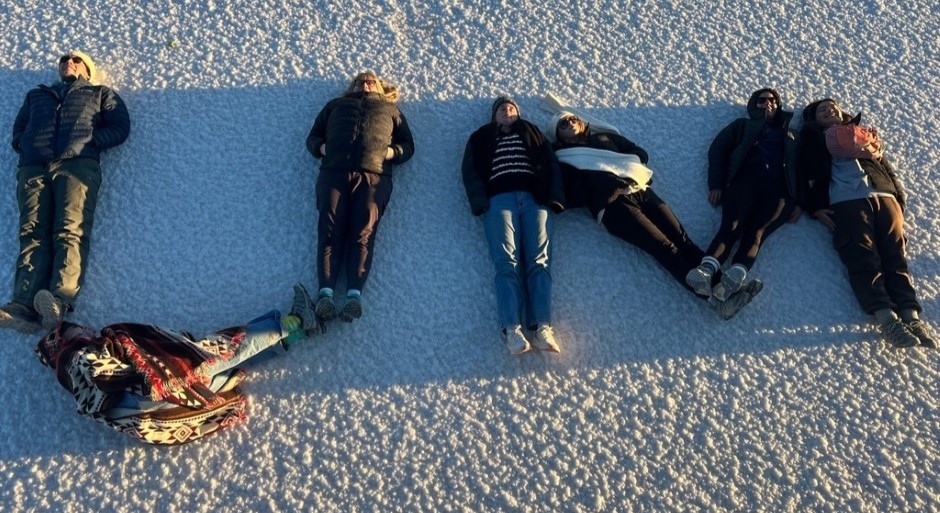students laid out on the salt lake to spell out UM
