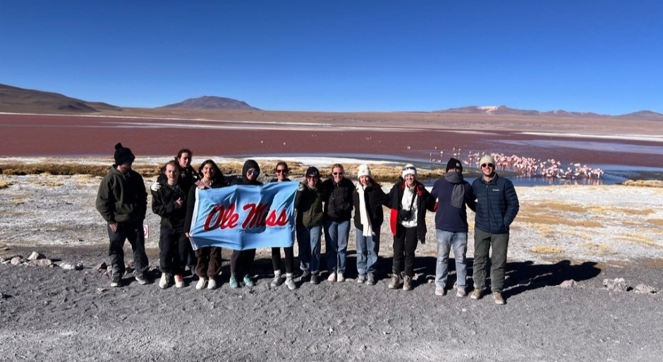 students in a group photo in the salt desert 