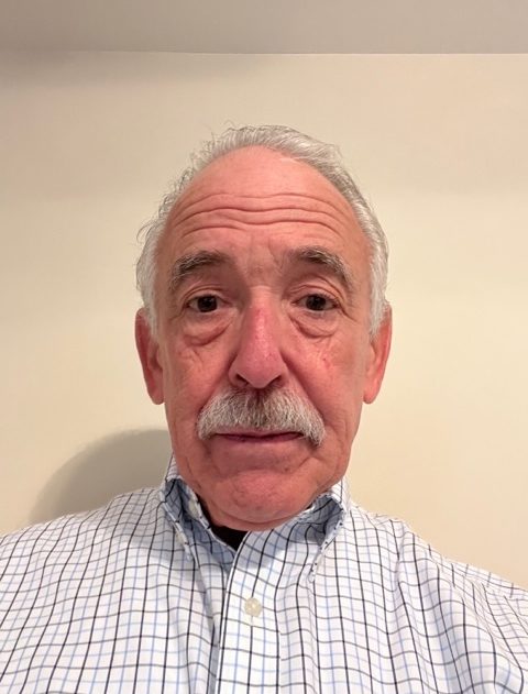 portrait of Marc Rosen against white wall