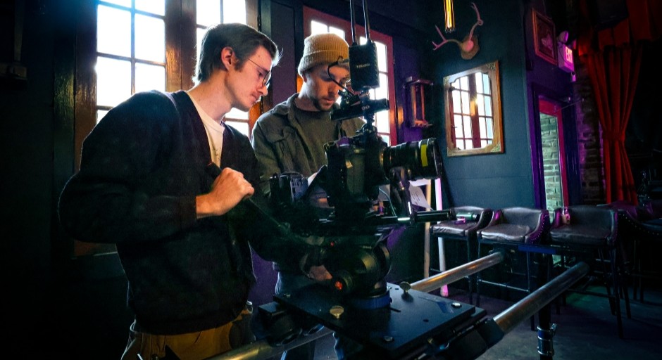 image of students working together on a film shoot in a local restaurant