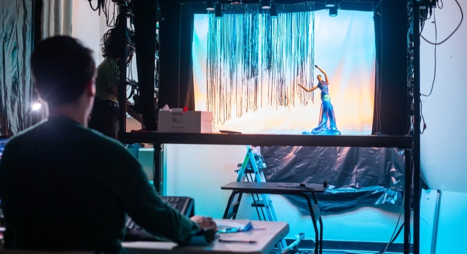 image of a doll on a miniature stage for lighting lab