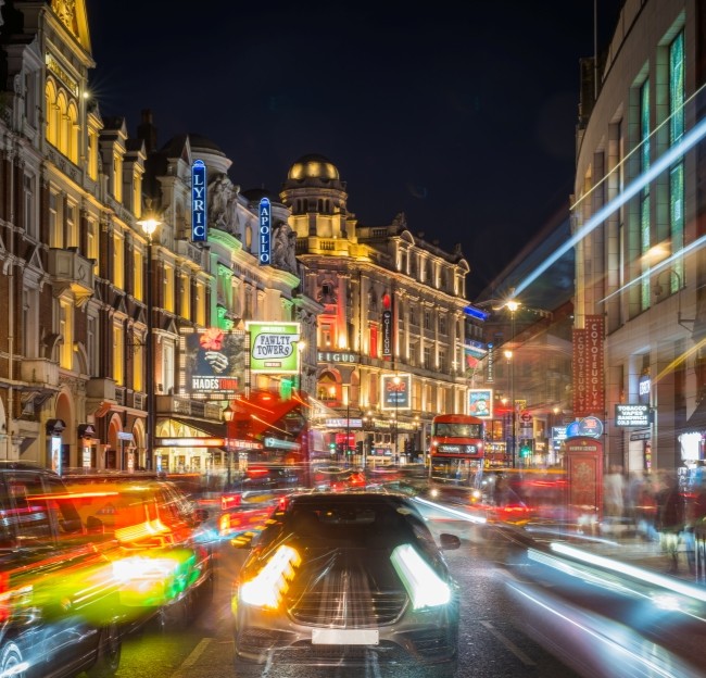 image of busy city street at night