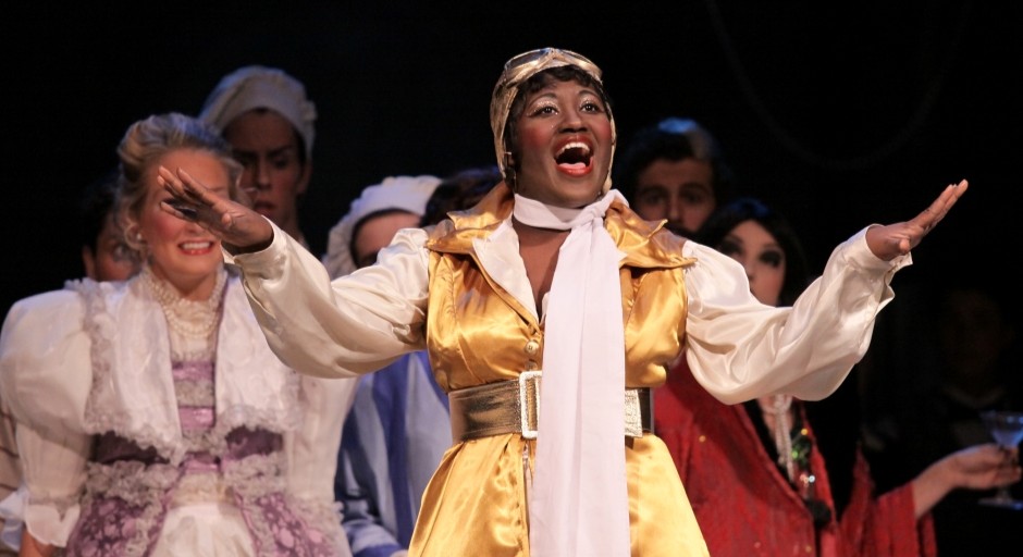 image of an actress singing on stage