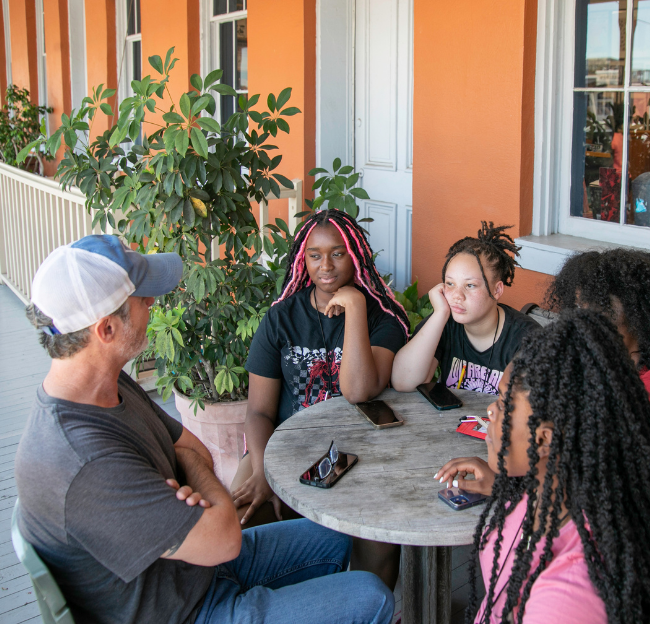 Photo of a faculty members interacting with a Good Life participant.