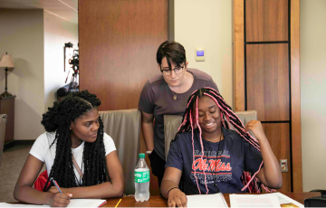 A good life faculty member helping a student.