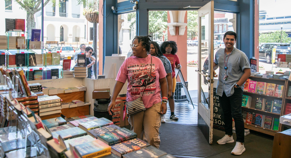 Student participant receiving a tour of Square Books.