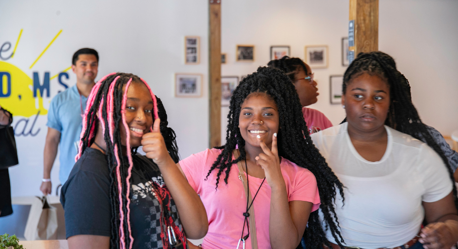 Two student participants smiling at an ice cream shop.