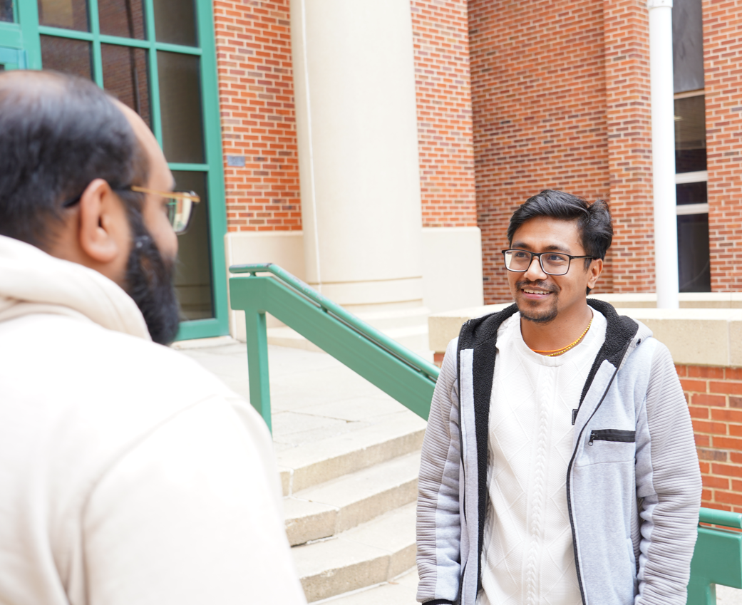 Pharmacy administration student talking with friend.