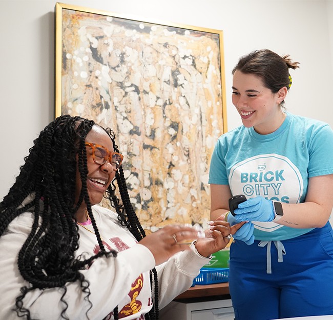 Resident checking blood sugar.