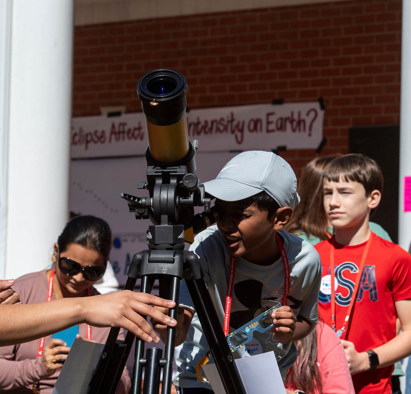 Youth looking through telescope