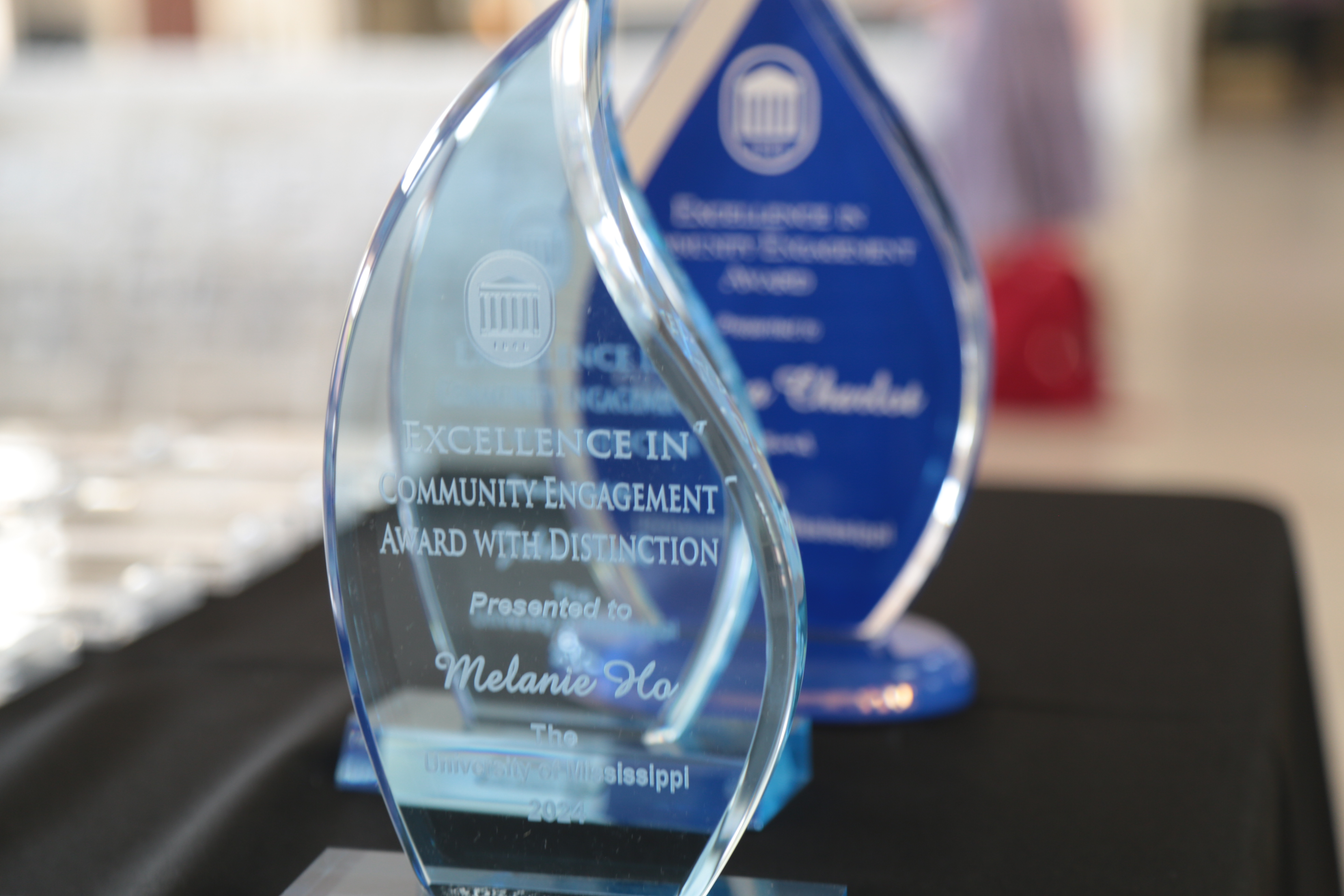 picture of three acrylic flame awards sitting on a table