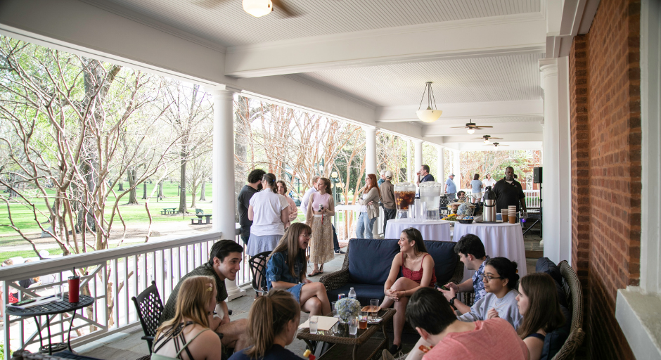 Croft students and alumni on porch at Croft 25th Anniversary
