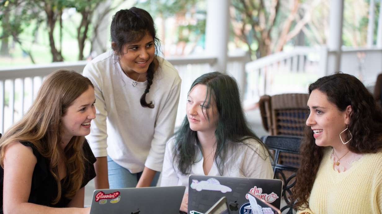 Students gathered around a computer