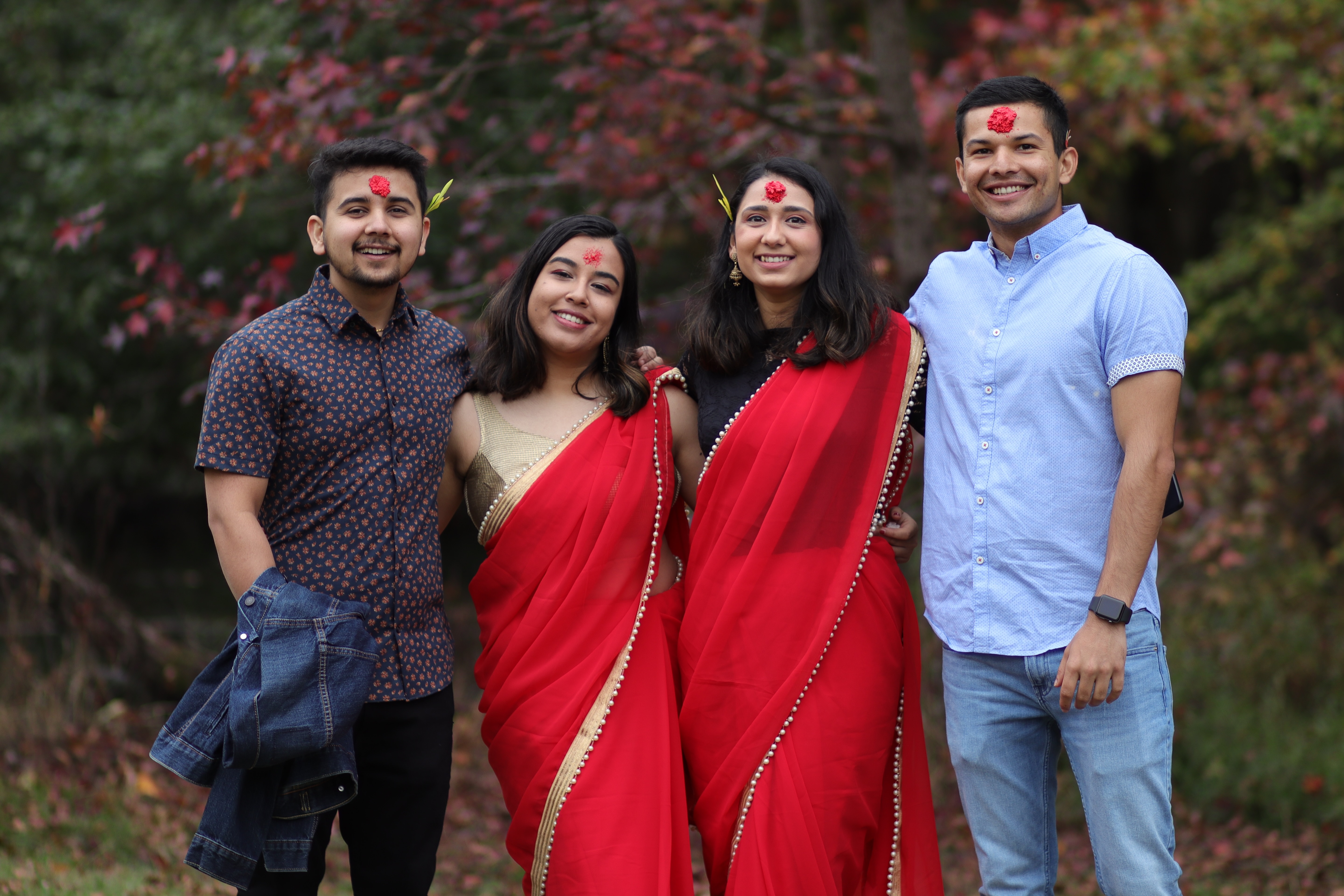 Four international students celebrating Nepali holiday