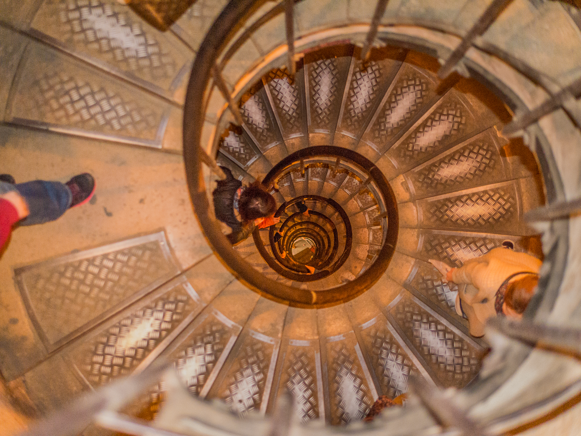 Top down view of a spiral staircase inside a building in Paris