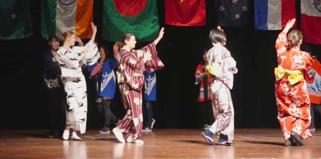 Individuals performs Bon-odori, a traditional Japanese dance