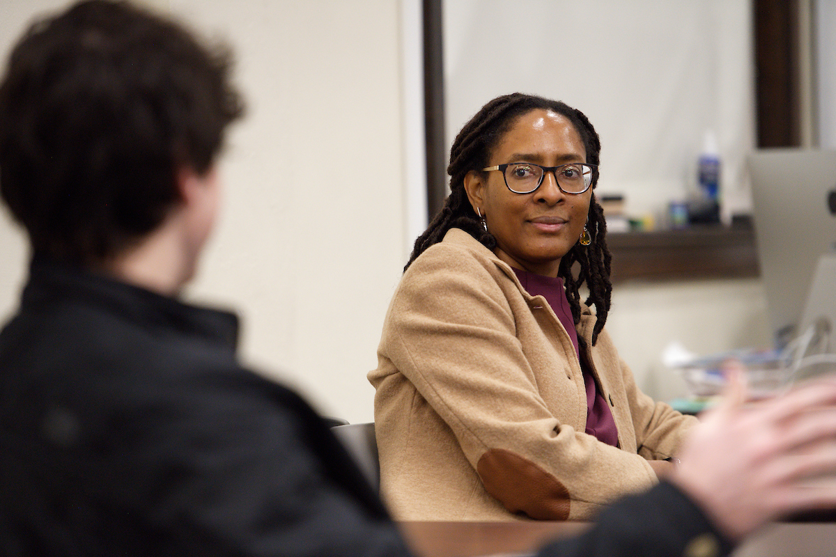 students speaking with teacher 