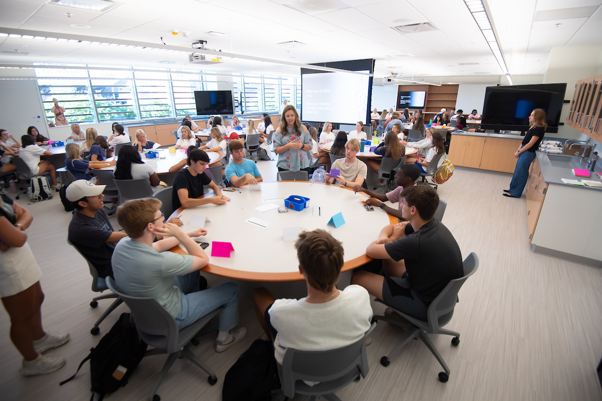 Students learning at a round table