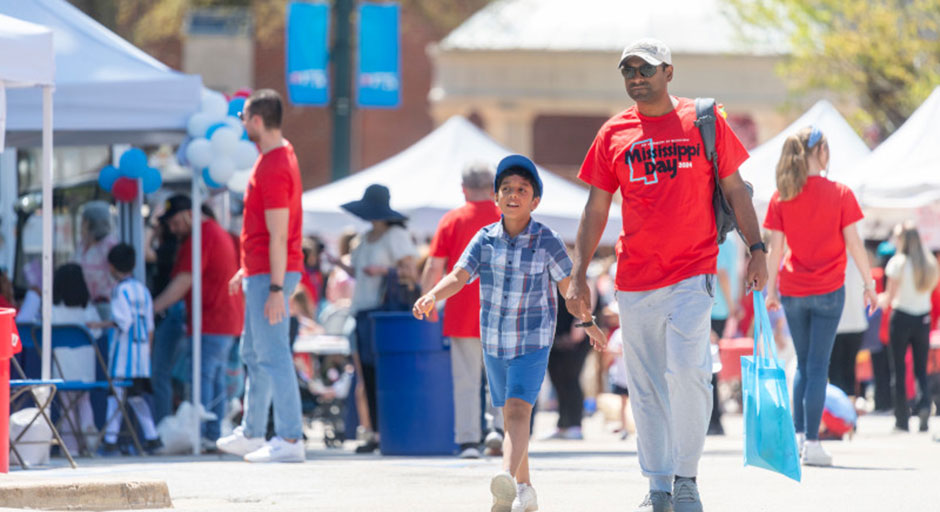 Attendees wander through the showcase tents at Mississippi Day 2024