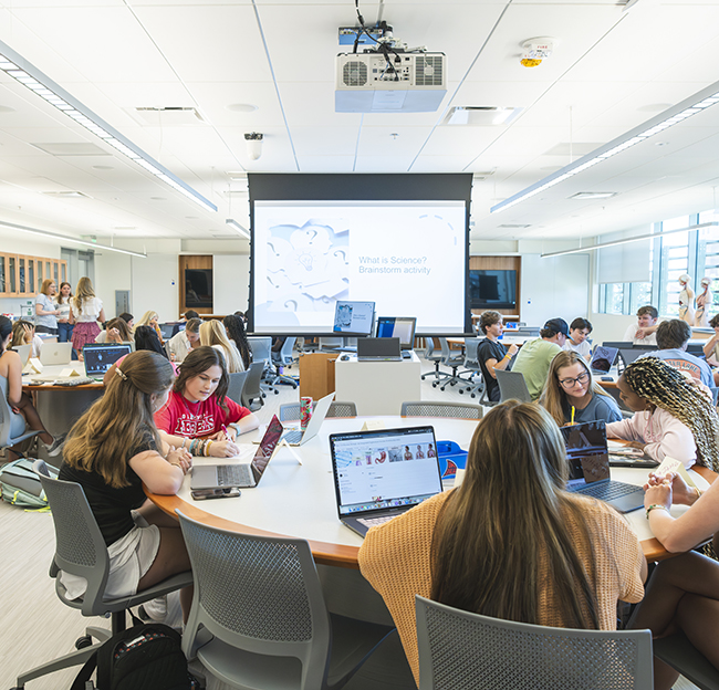 teal class room with students in class