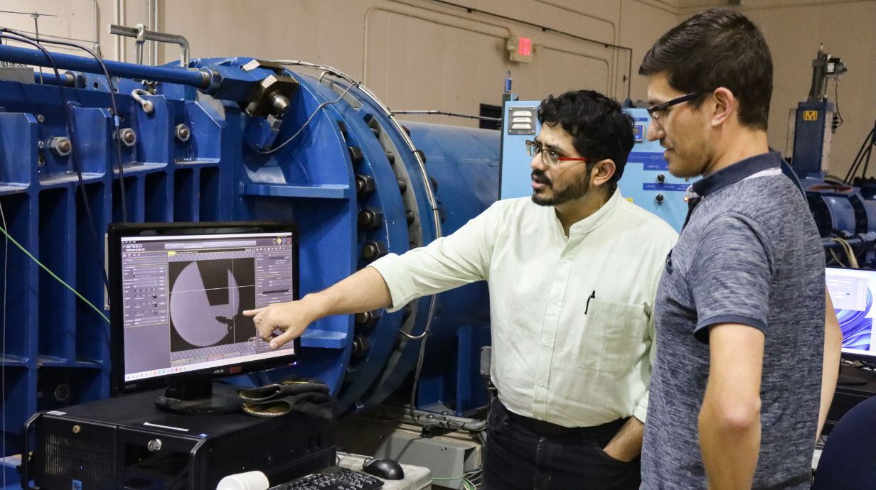 Researchers looking at wind tunnel data