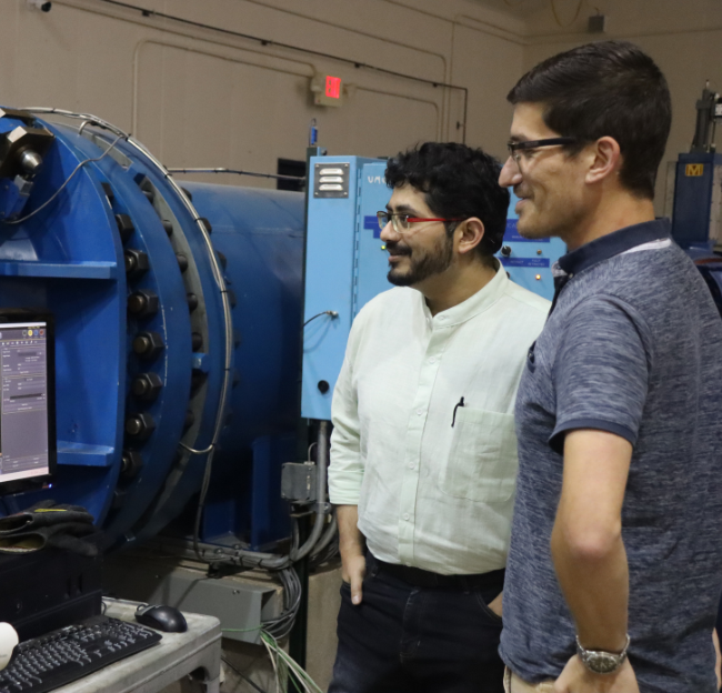Researchers look at the results of a test on the wind tunnel at NCPA.