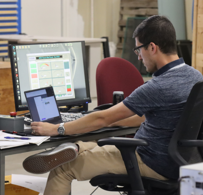 NCPA research reviews data on his laptop.