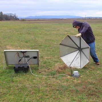 person setting up research equipment