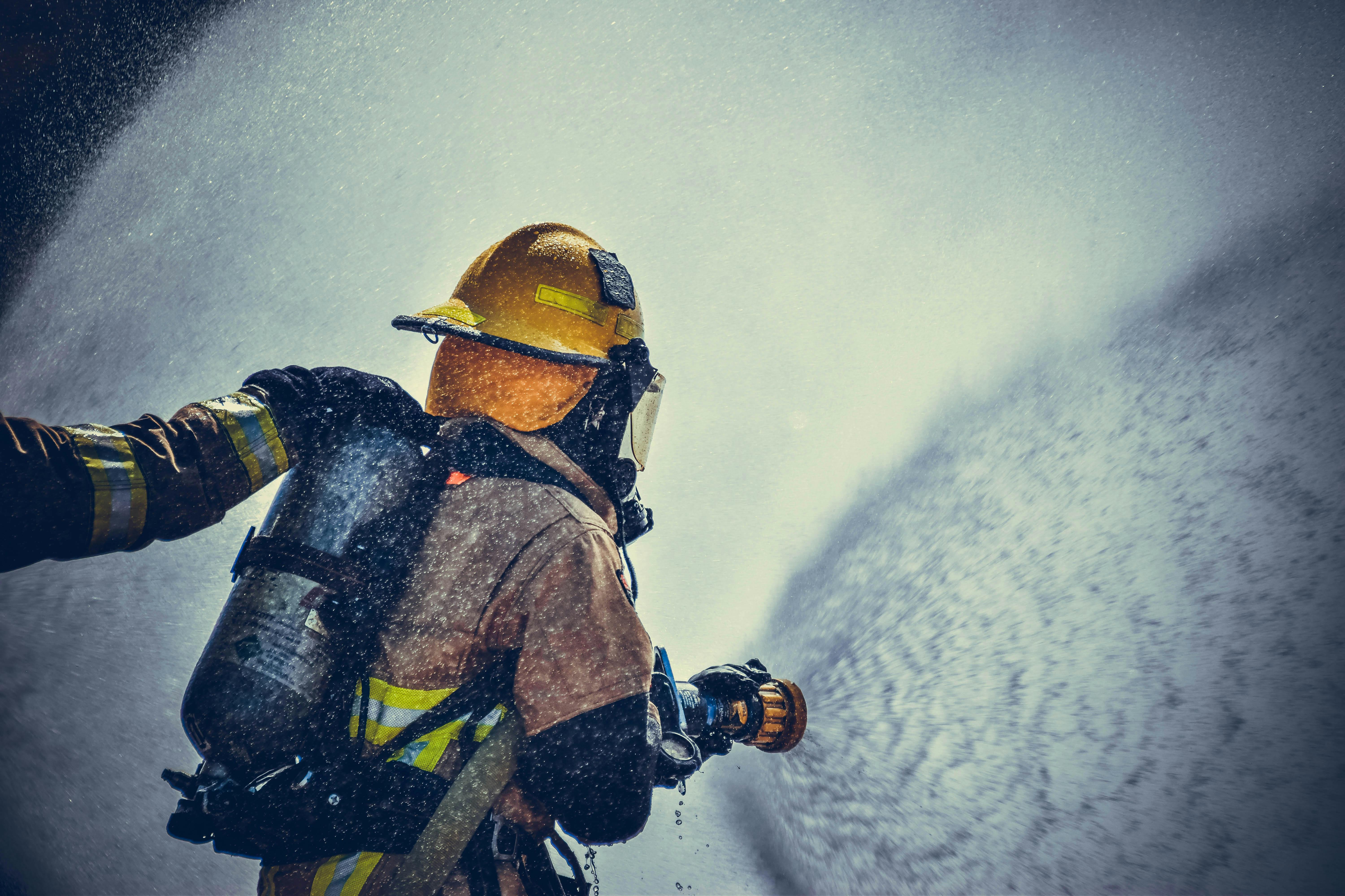 firefighter spraying water