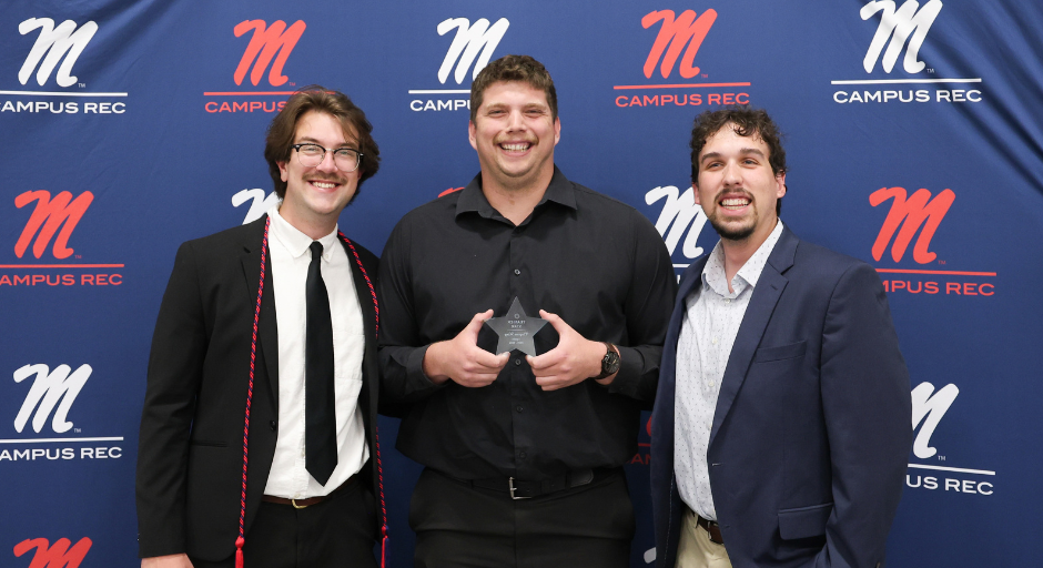 Student employee receiving award.