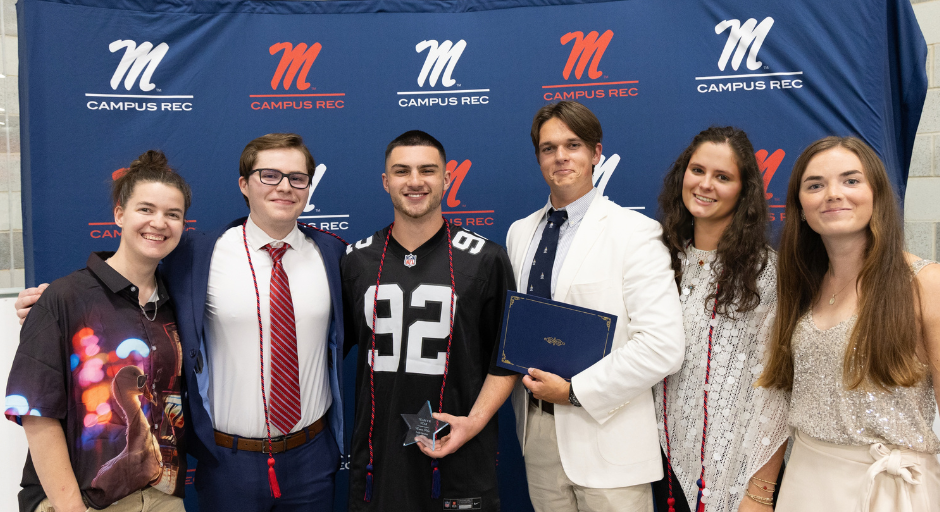 Student employee receiving award.