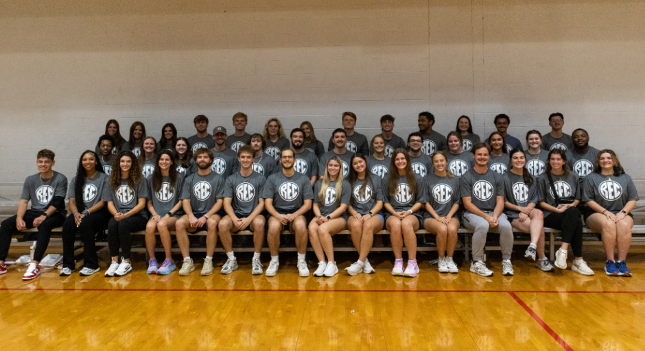 Facility Operations student employees sitting on bleachers.