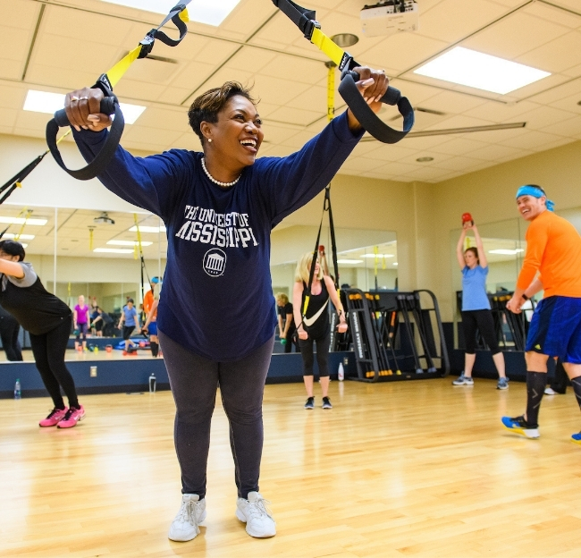 University employee participating in a group fitness class.