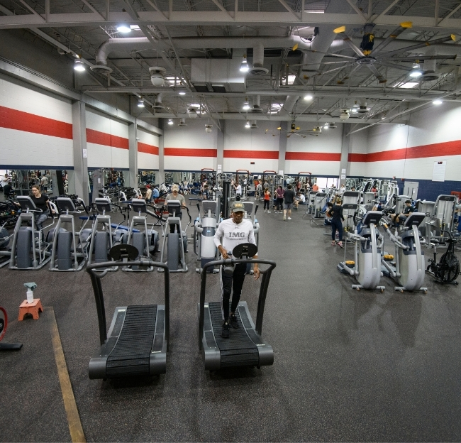 Individuals working out in the Turner Center fitness center