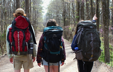 Three people backpacking
