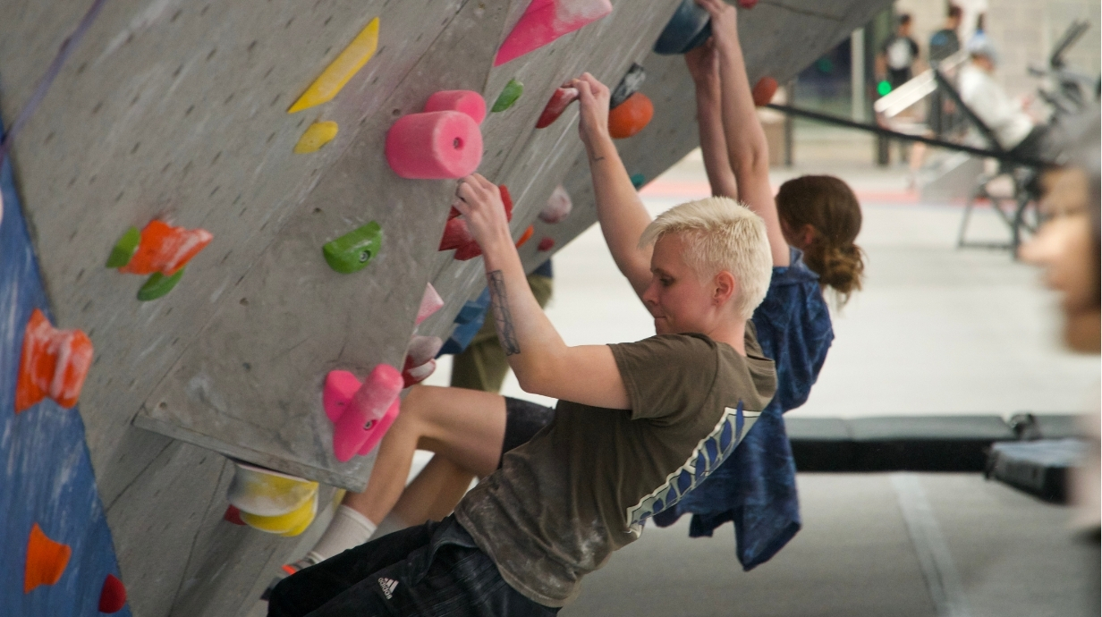 Two student climbing on the bouldering wall.