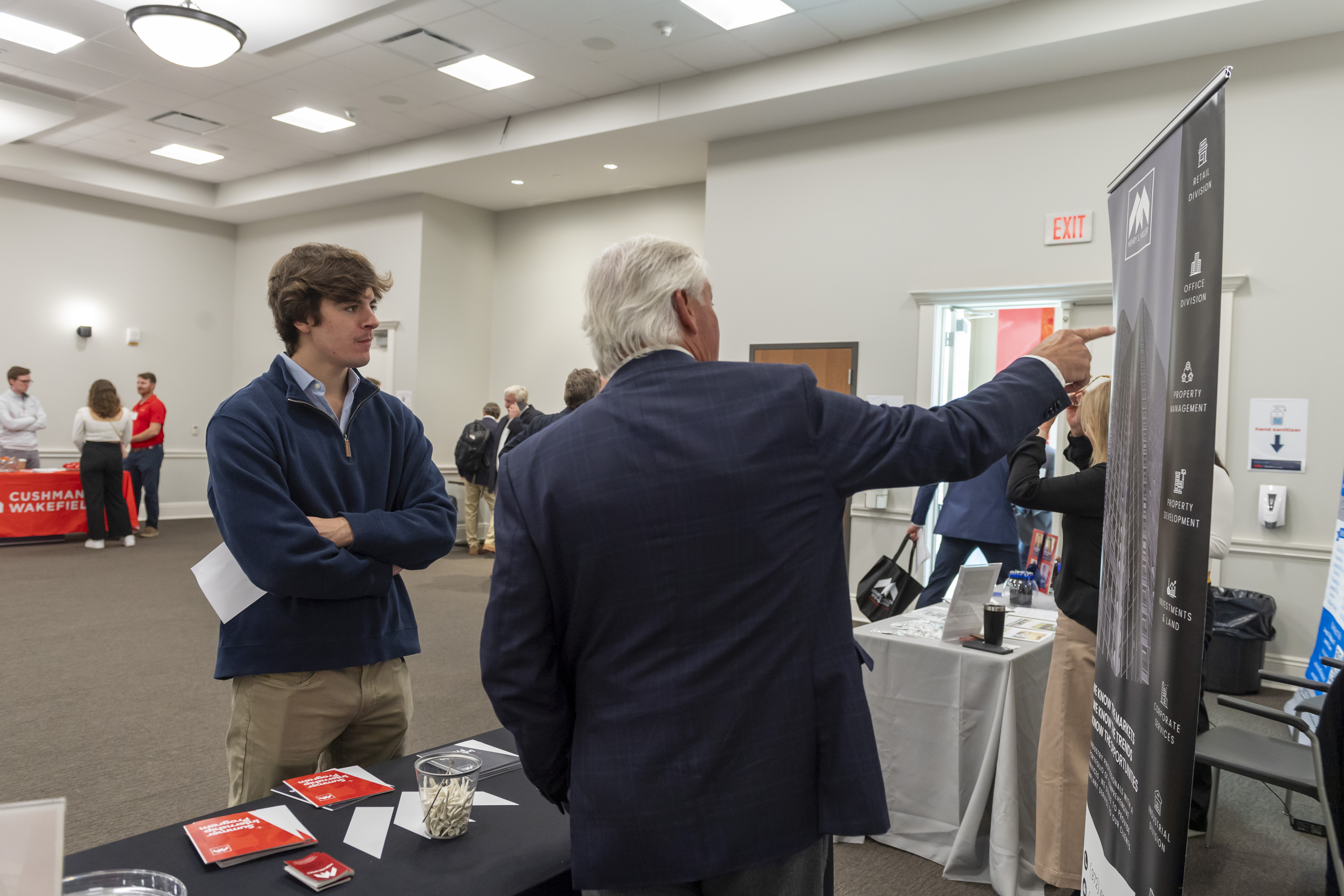 Image of student looking at a presentation at a career fair.