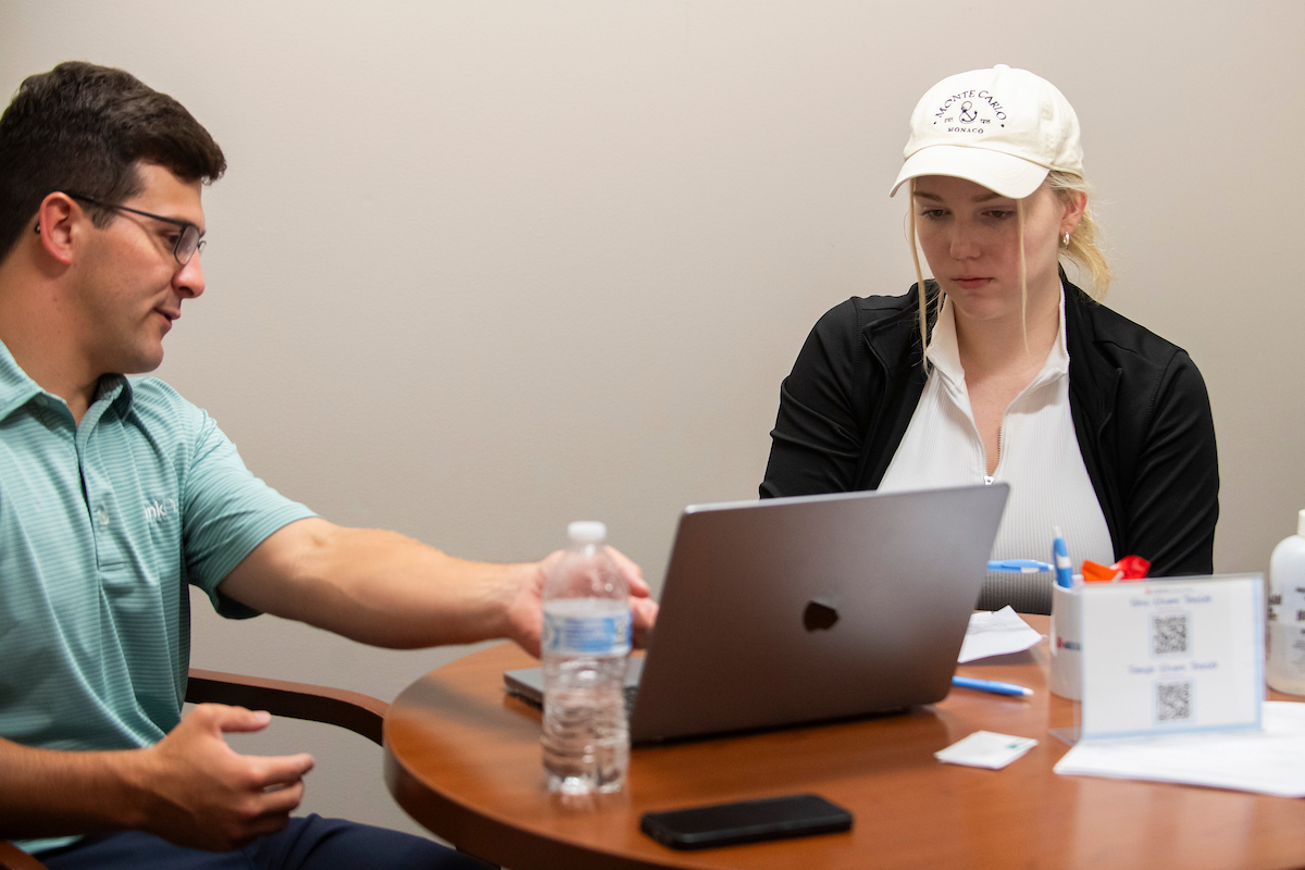 student getting guidance from a mentor