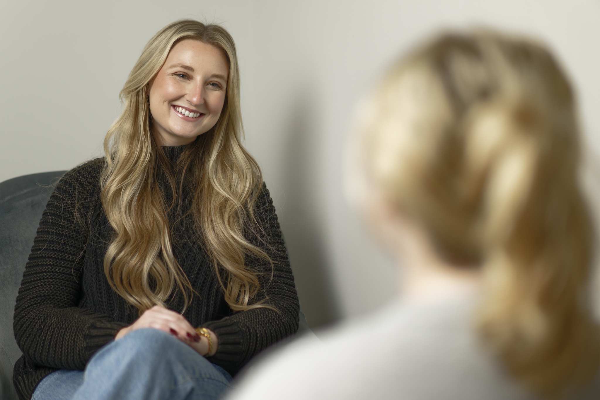 A therapist listening to her client