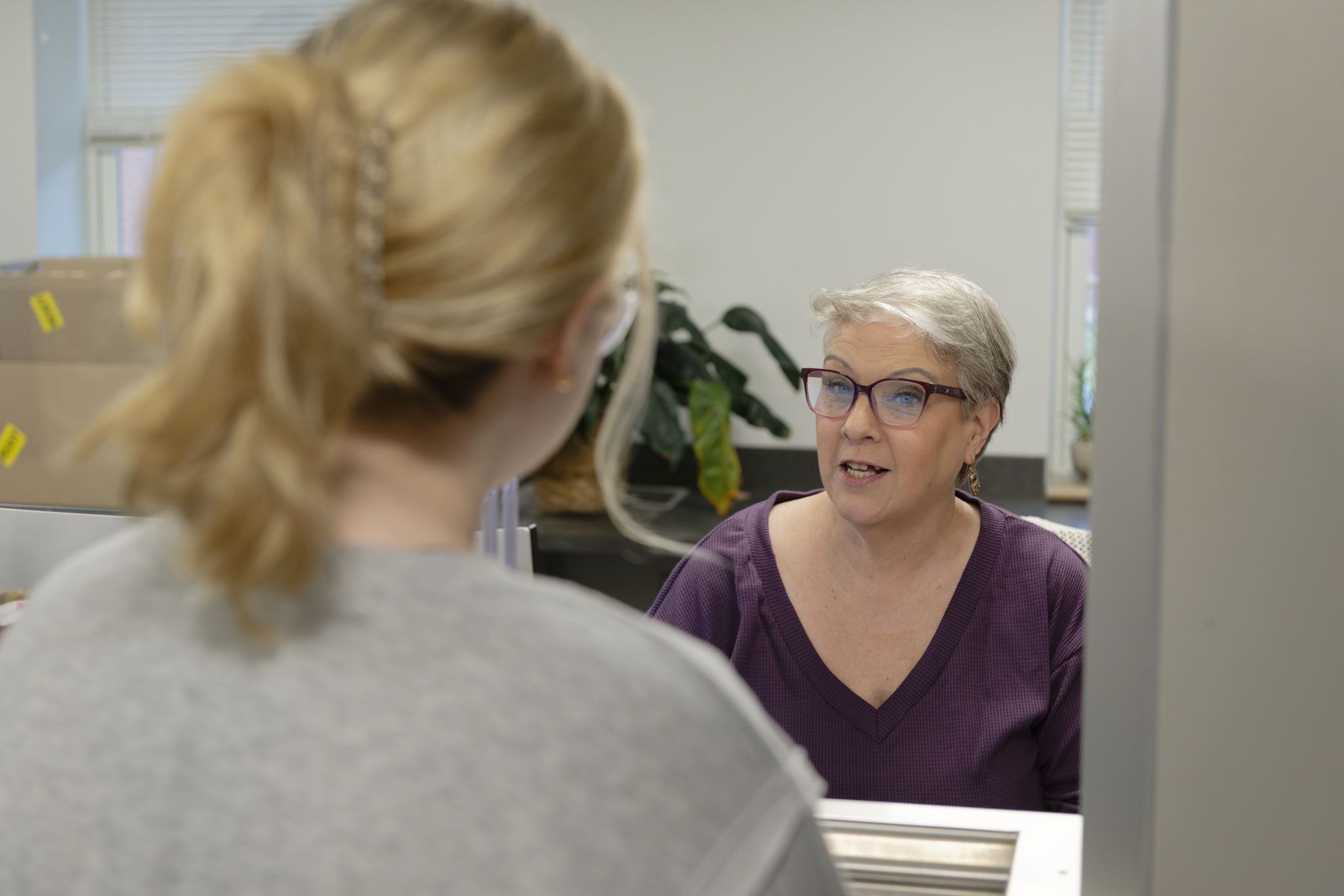 client checking in with a receptionist