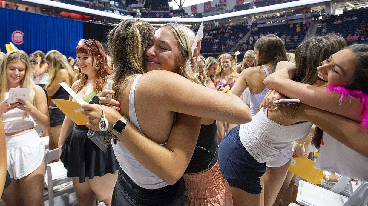 Two new CPH members hug on Formal recruitment bid day