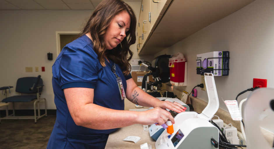 Lab technician runs tests in lab.