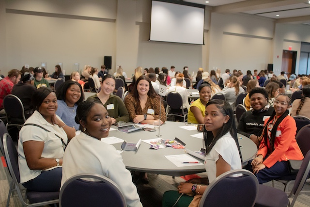 Students  smiling at an event