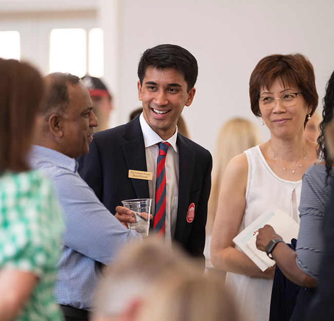 Columns society member talking to patrons