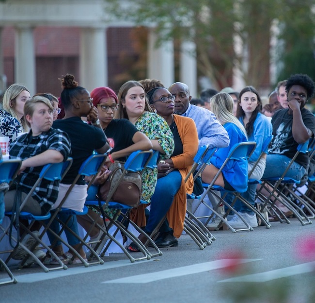 Students, staff, faculty, and campus community members gather at the Longest Table for dinner and conversation. 