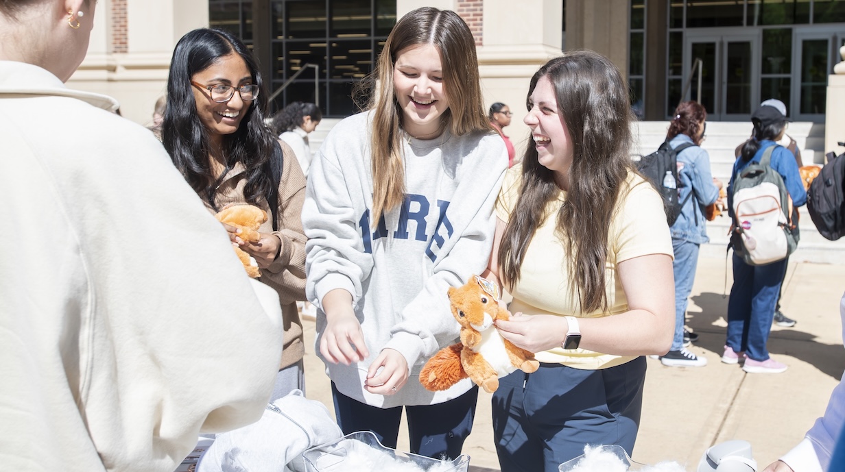 Students participate in a "Build a Grove Squirrel" event on the Student Union Plaza.